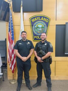 Wayland Police Department Acting Chief Mark Hebert (left) gave a commendation to Officer David Fors, and the entire shift and dispatcher for their work in finding the Acton murder suspect. (Photo courtesy of Wayland Police Department)