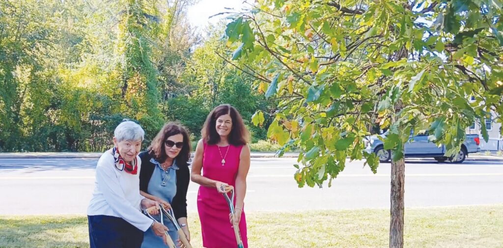 Wayland Rev250 Chair Mary Antes, Juliette Fay, and Select Board Chair Carol Martin plant a white oak during the Liberty Tree ceremony on Constitution Day on Sept. 17 as part of the 250th anniversary celebration of the American Revolution. (Photo by Carole Plumb)
