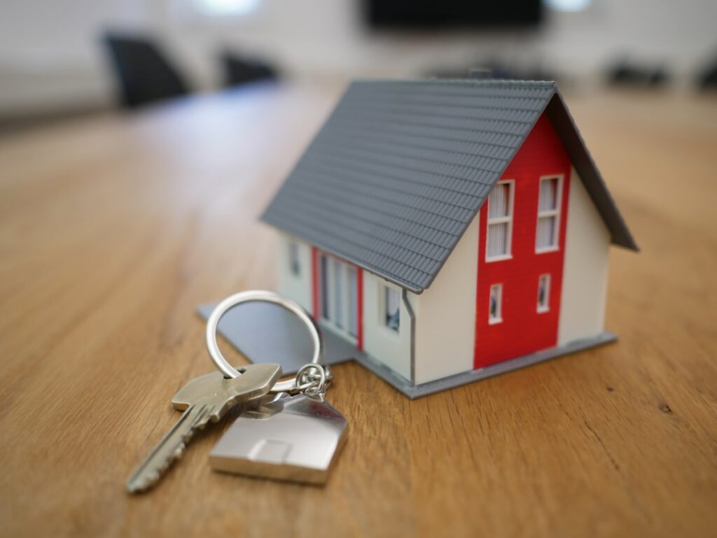 House miniature representing property tax (Unsplash, free license)