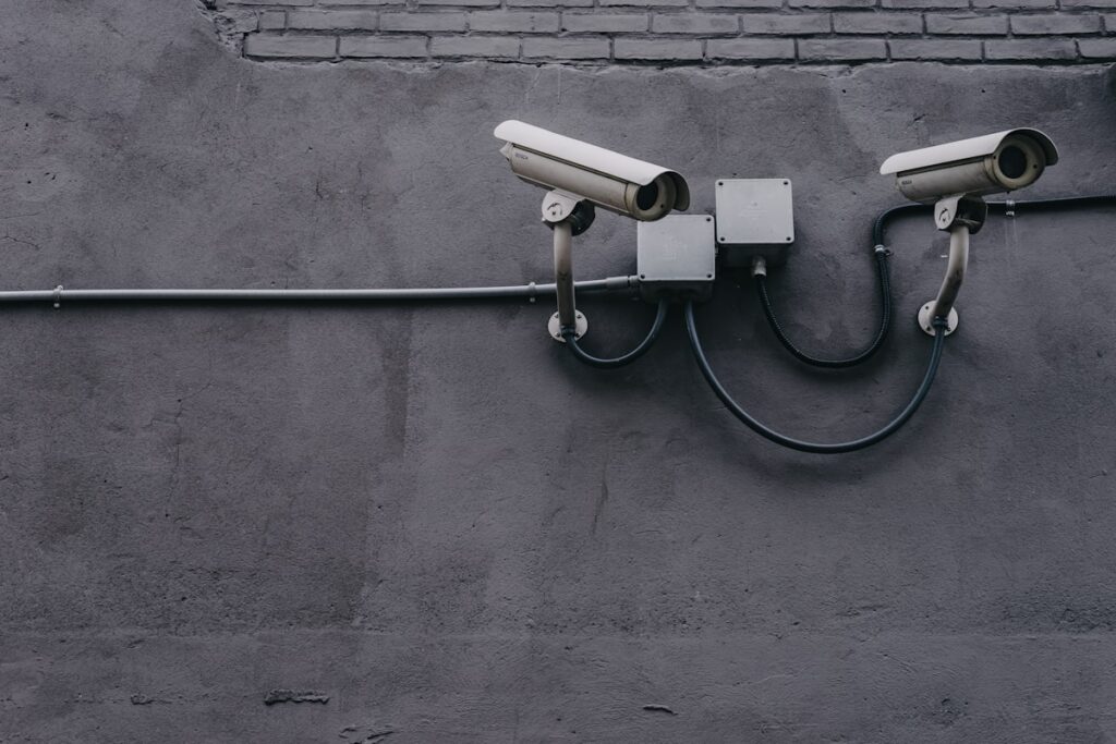 Surveillance cameras on wall (Unsplash, free license)