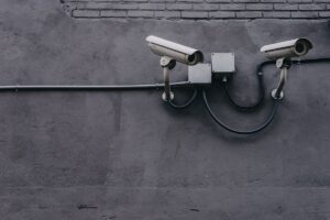 Surveillance cameras on wall (Unsplash, free license)