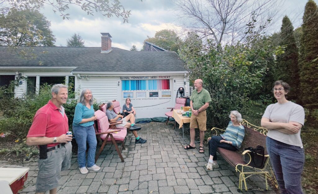 Friends and neighbors gathered at the von Mering driveway in Wayland for the climate driveway happy hour. (Photo by Sabine von Mering)