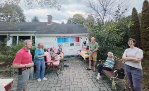 Friends and neighbors gathered at the von Mering driveway in Wayland for the climate driveway happy hour. (Photo by Sabine von Mering)