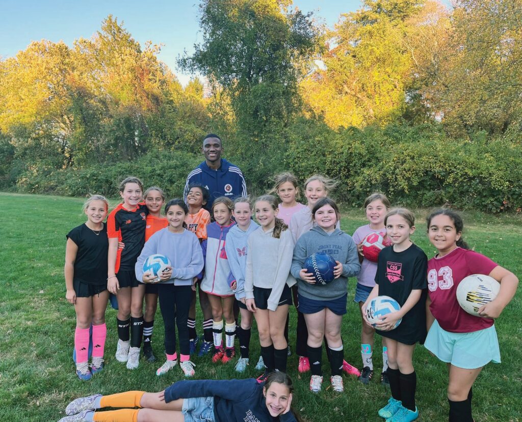 New England Revolution defender Mamadou Fofana recently spent time with a youth soccer team in Wayland, helping lead a training session and connecting with players.