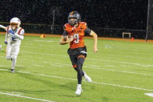 Senior quarterback Mikey Johansson has led the undefeated Warriors with his throwing and running. (Photo by Bo Finnegan)