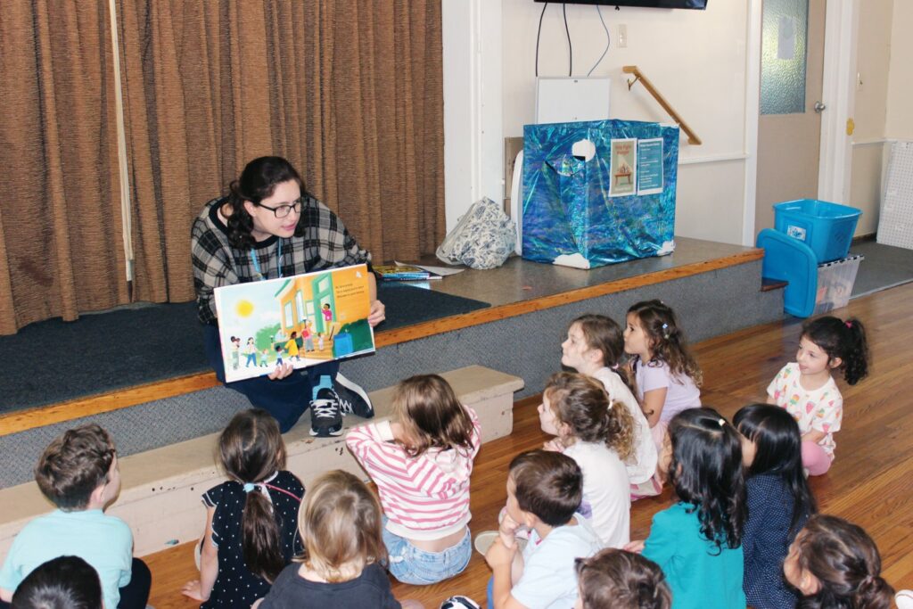 Haley Neil from the Wayland Public Library visited students at Community Nursery School of Wayland on Oct. 5. She read to the students and explained all the fun and interesting things to do when visiting the library. (Photo courtesy Community Nursery School)